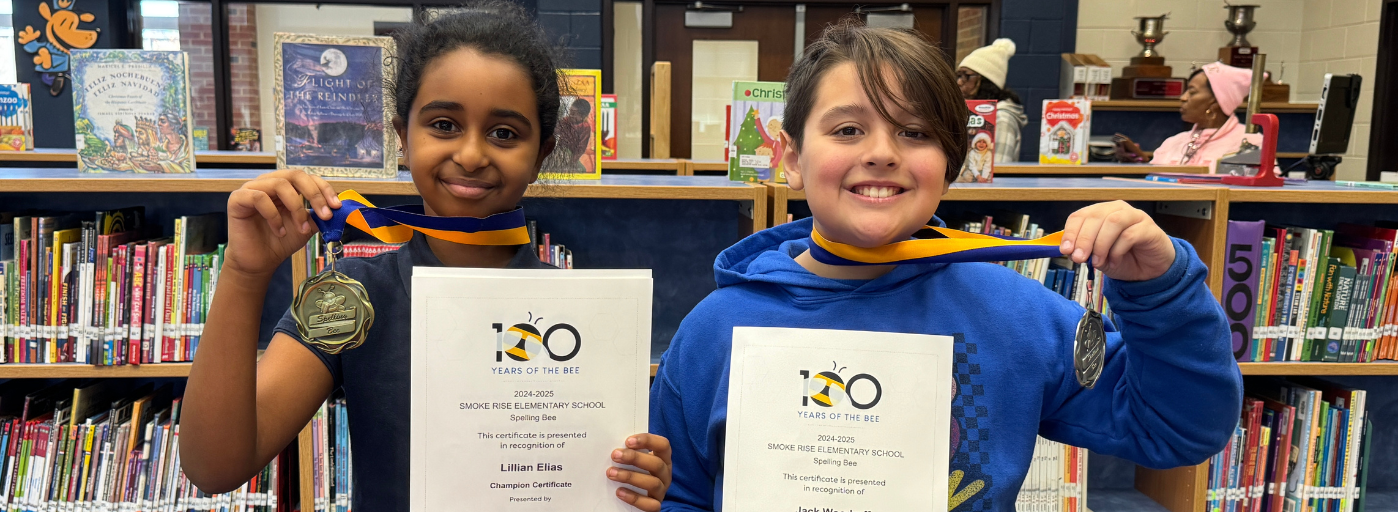 Two Spelling Bee students holding medals and certificates.